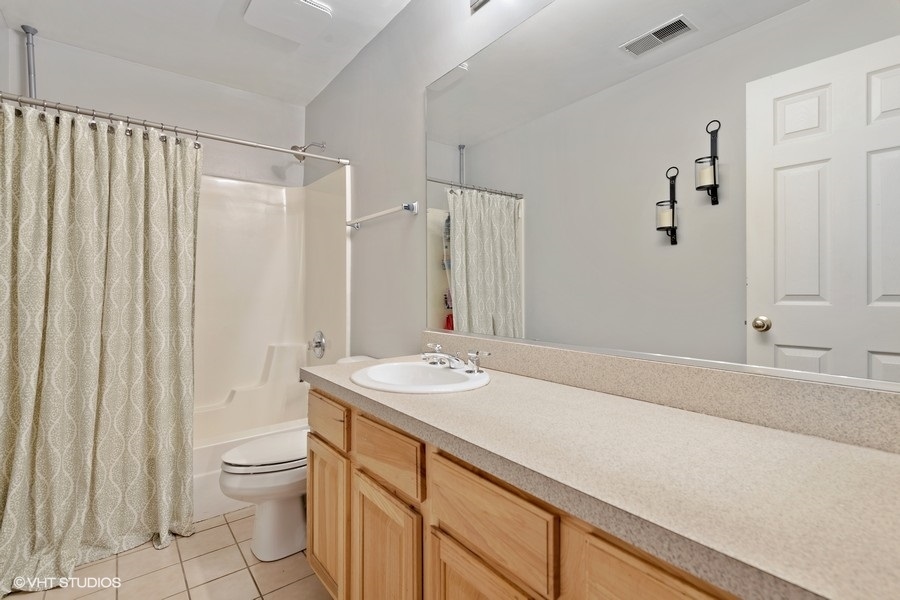 649 West Division Street, Unit B Chicago, IL 60610 - Photo 11 of 15 a bathroom with a sink a toilet and shower