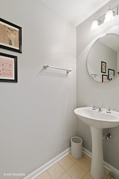 649 West Division Street, Unit B Chicago, IL 60610 - Photo 13 of 15 a white toilet sitting next to a bathroom sink