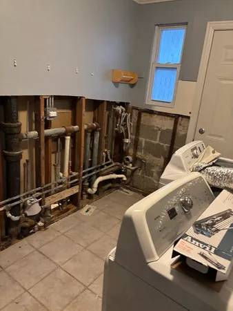a room with water heater and storage