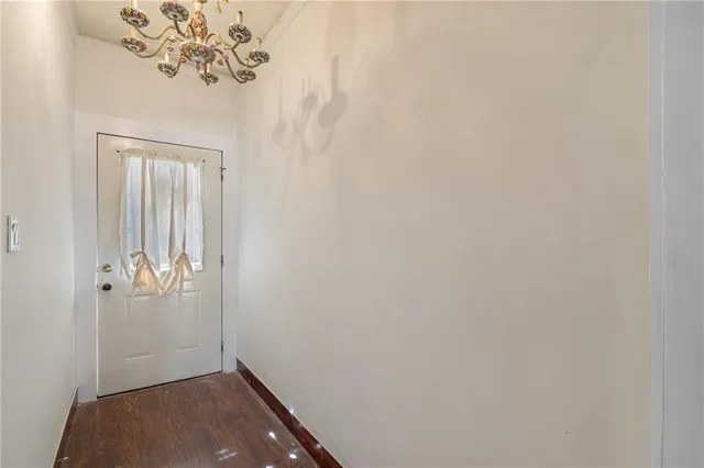 wooden floor in a hall with a window