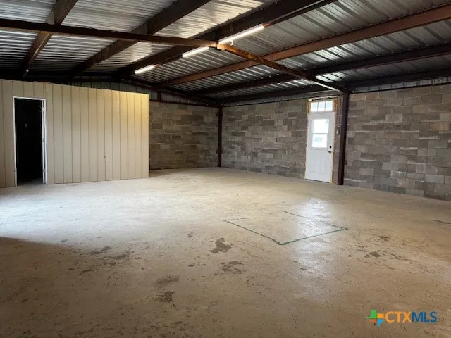 a view of an empty room with storage
