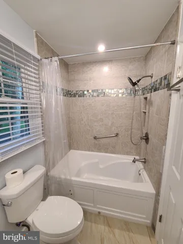 a view of a livingroom with a staircase