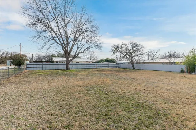a view of a yard with an outdoor space