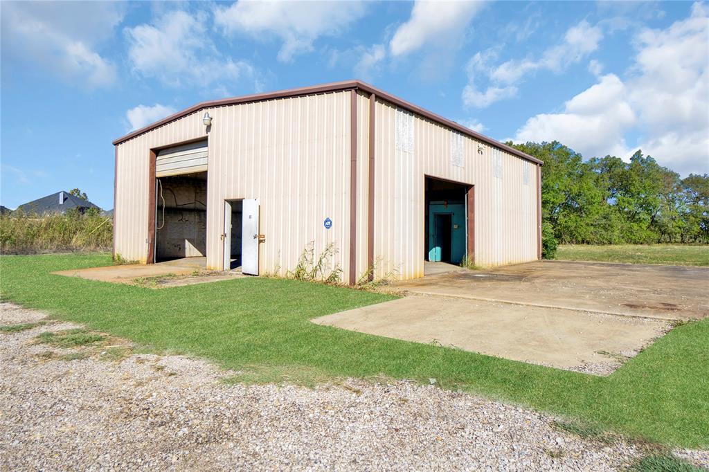 6000 Interstate 30 Fate, TX 75087 - Photo 14 of 18 a view of a house with backyard and garden