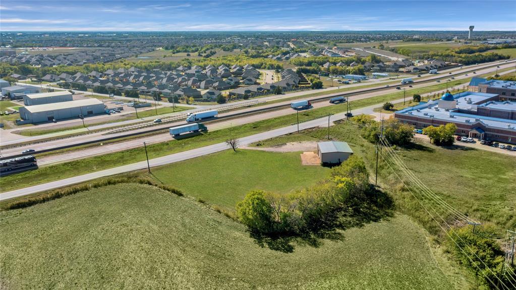 6000 Interstate 30 Fate, TX 75087 - Photo 2 of 18 a view of a lake with a city