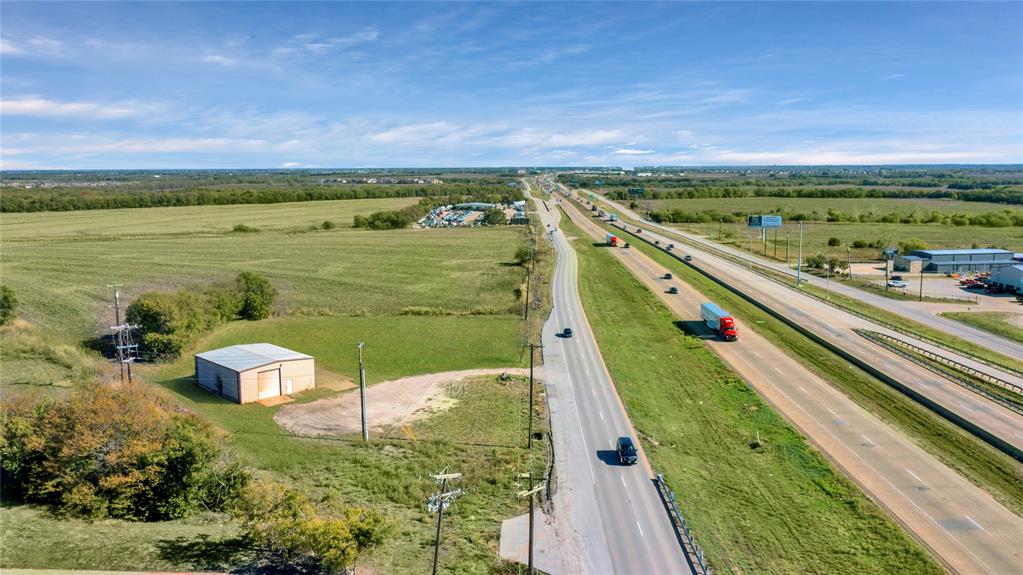 6000 Interstate 30 Fate, TX 75087 - Photo 5 of 18 a view of a lake with a big yard