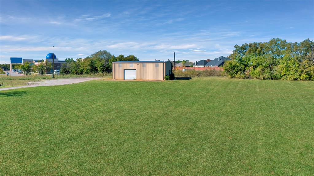6000 Interstate 30 Fate, TX 75087 - Photo 9 of 18 a view of a house with a big yard