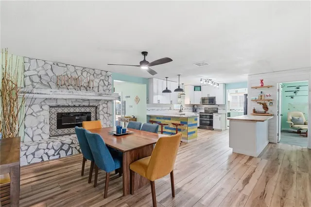 a dining room with furniture and wooden floor
