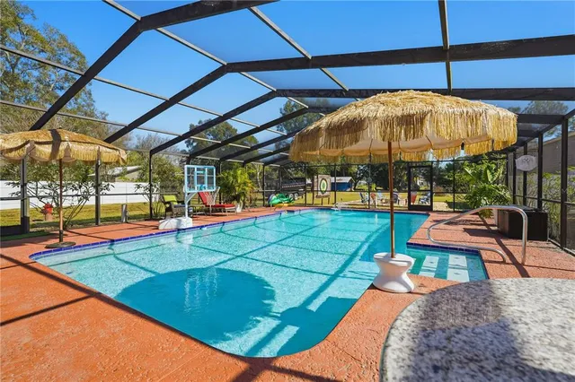 a view of a swimming pool with a patio