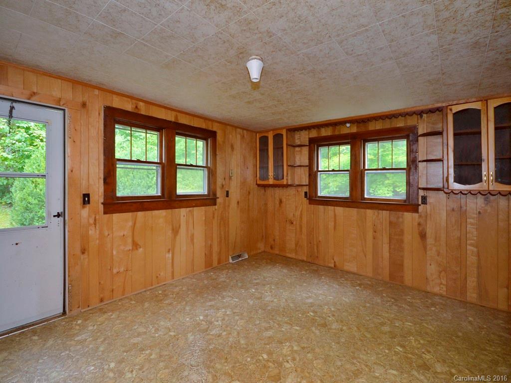 273 Pot Leg Road Waynesville, NC 28785 - Photo 5 of 12 an empty room with windows