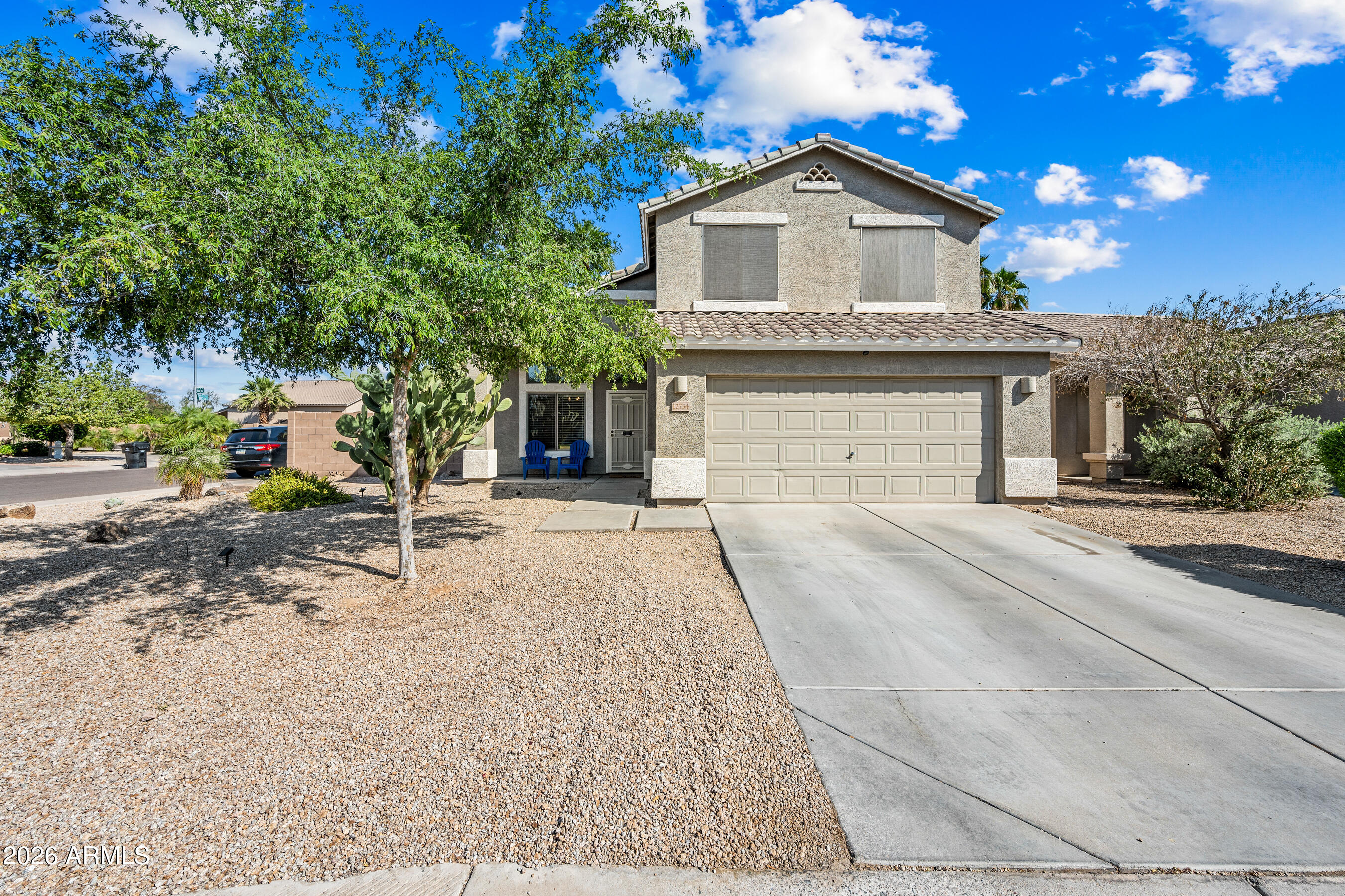 12734 West Cheery Lynn Road Avondale, AZ 85392 - Photo 9 of 54 a front view of a house with a yard and garage
