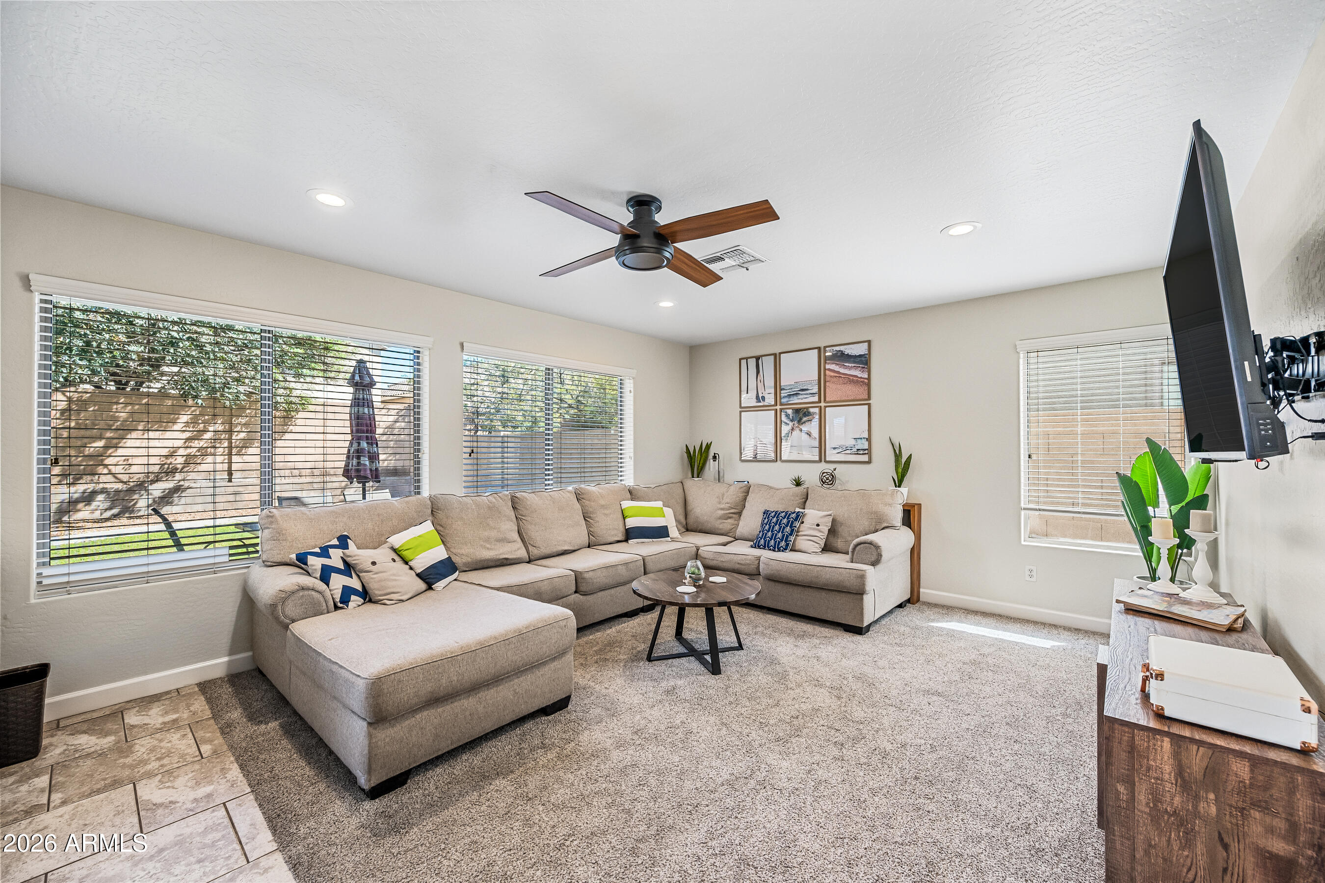 12734 West Cheery Lynn Road Avondale, AZ 85392 - Photo 17 of 54 a living room with furniture and a flat screen tv