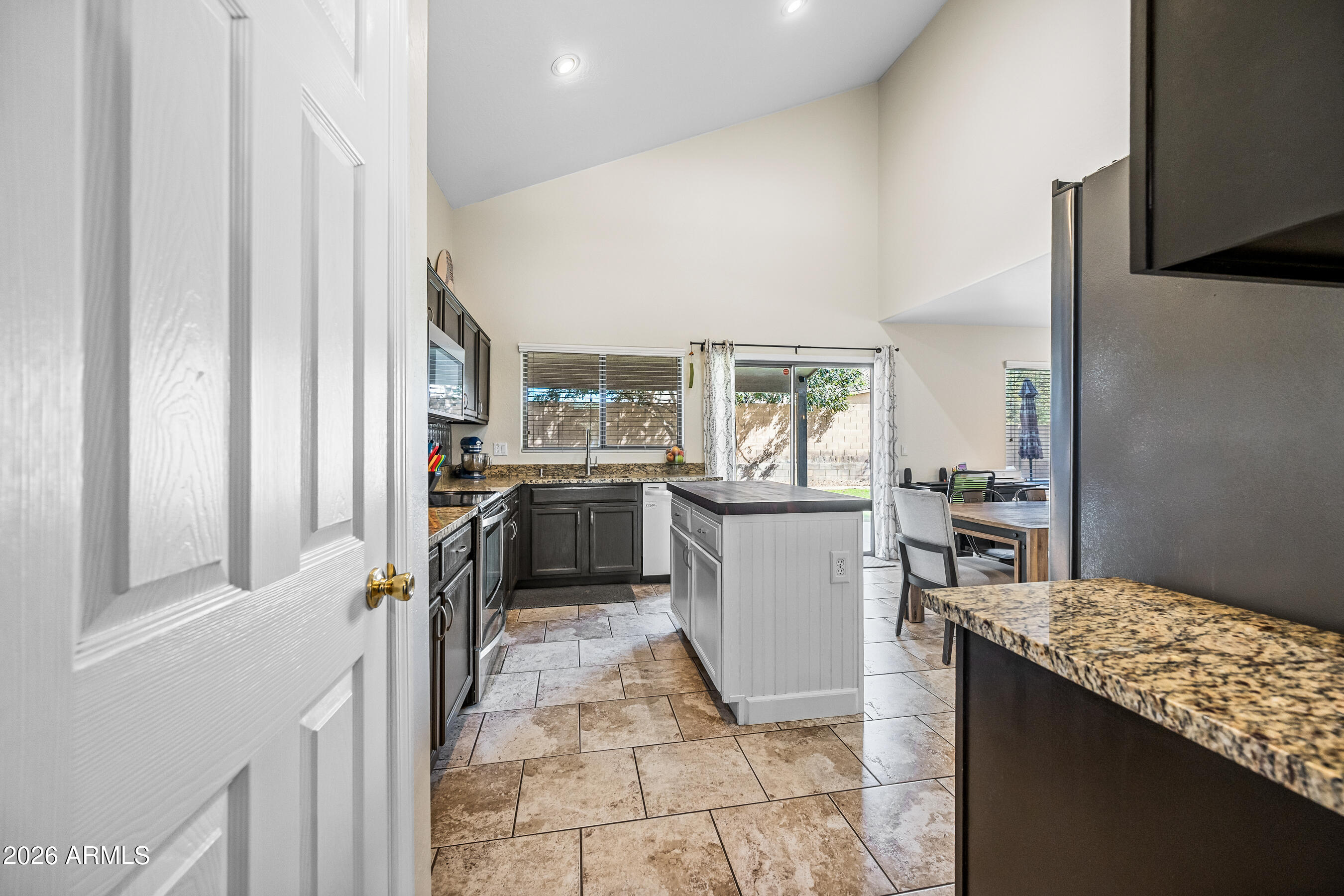 12734 West Cheery Lynn Road Avondale, AZ 85392 - Photo 20 of 54 a kitchen with a refrigerator and a stove