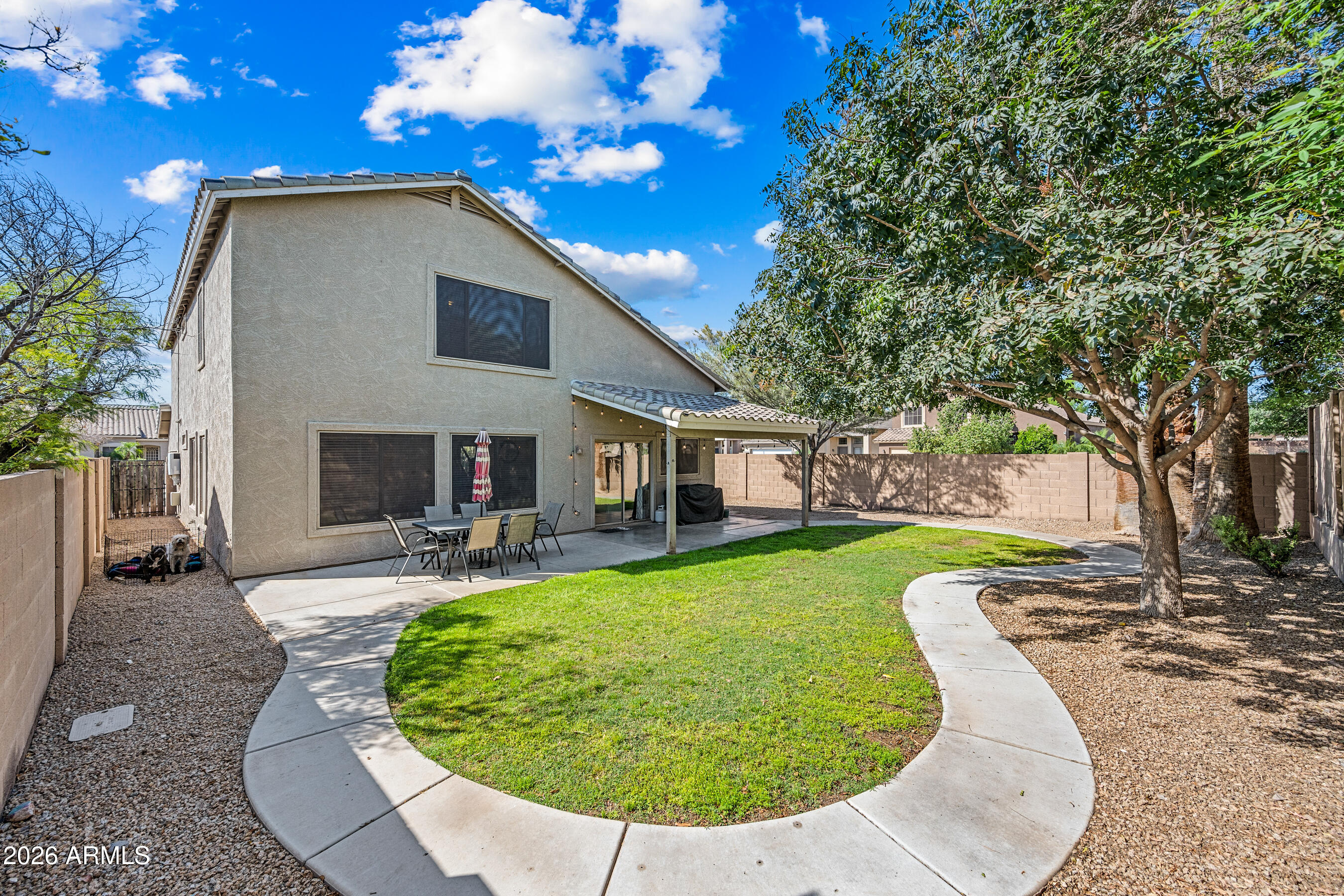 12734 West Cheery Lynn Road Avondale, AZ 85392 - Photo 28 of 54 a view of a house with a yard porch and sitting area