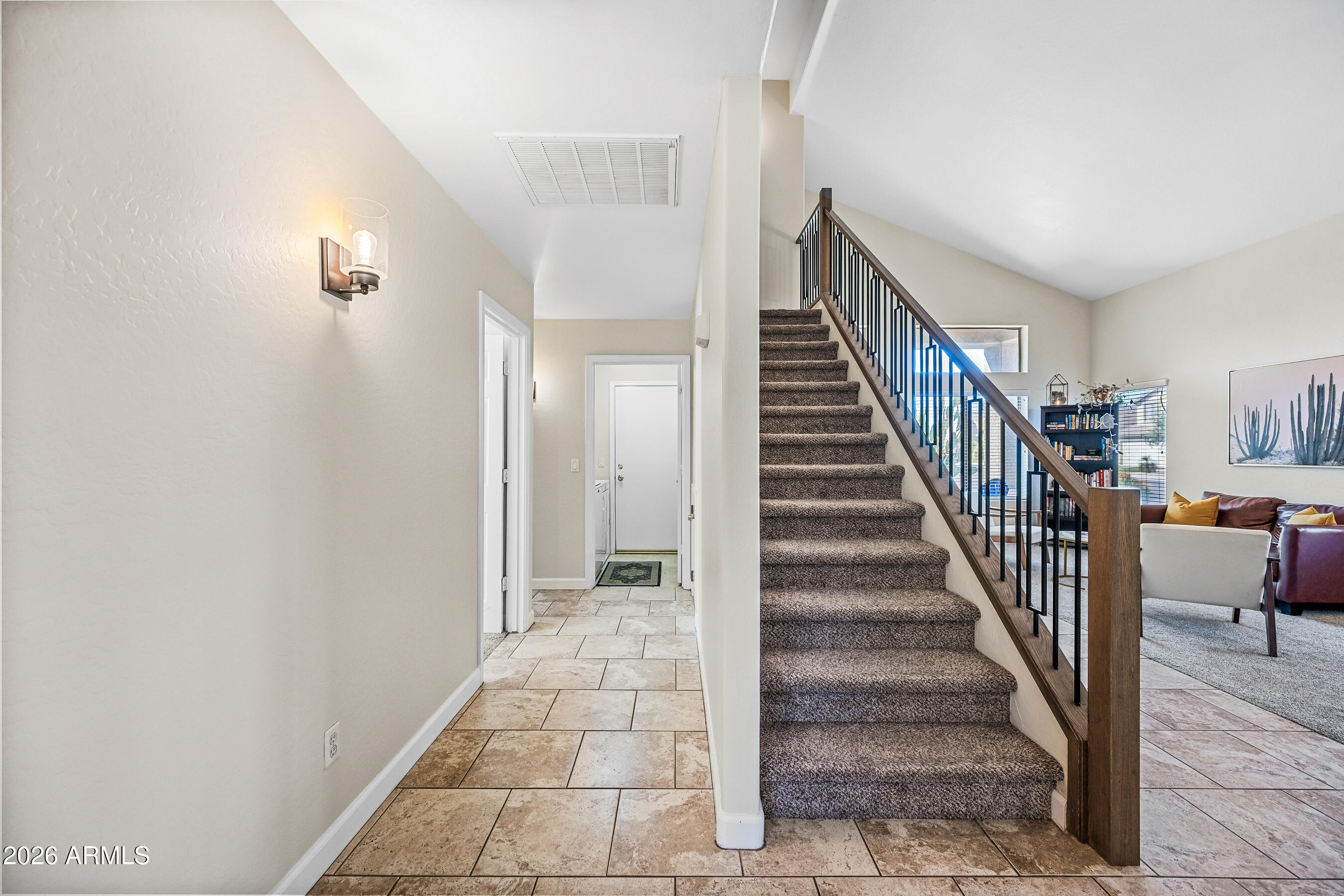 12734 West Cheery Lynn Road Avondale, AZ 85392 - Photo 30 of 54 a view of entryway and hall with wooden floor