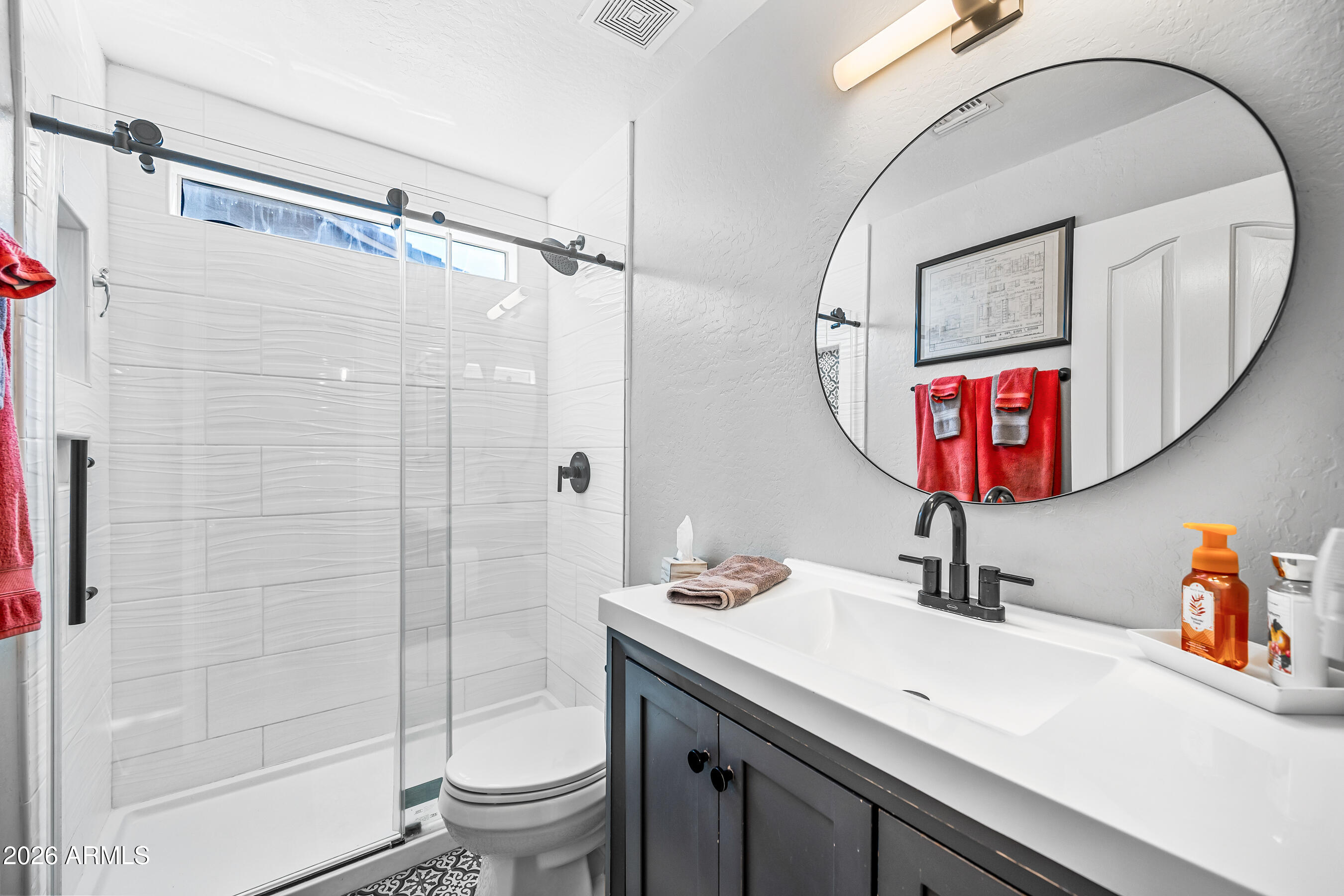 12734 West Cheery Lynn Road Avondale, AZ 85392 - Photo 33 of 54 a bathroom with a sink a toilet and shower