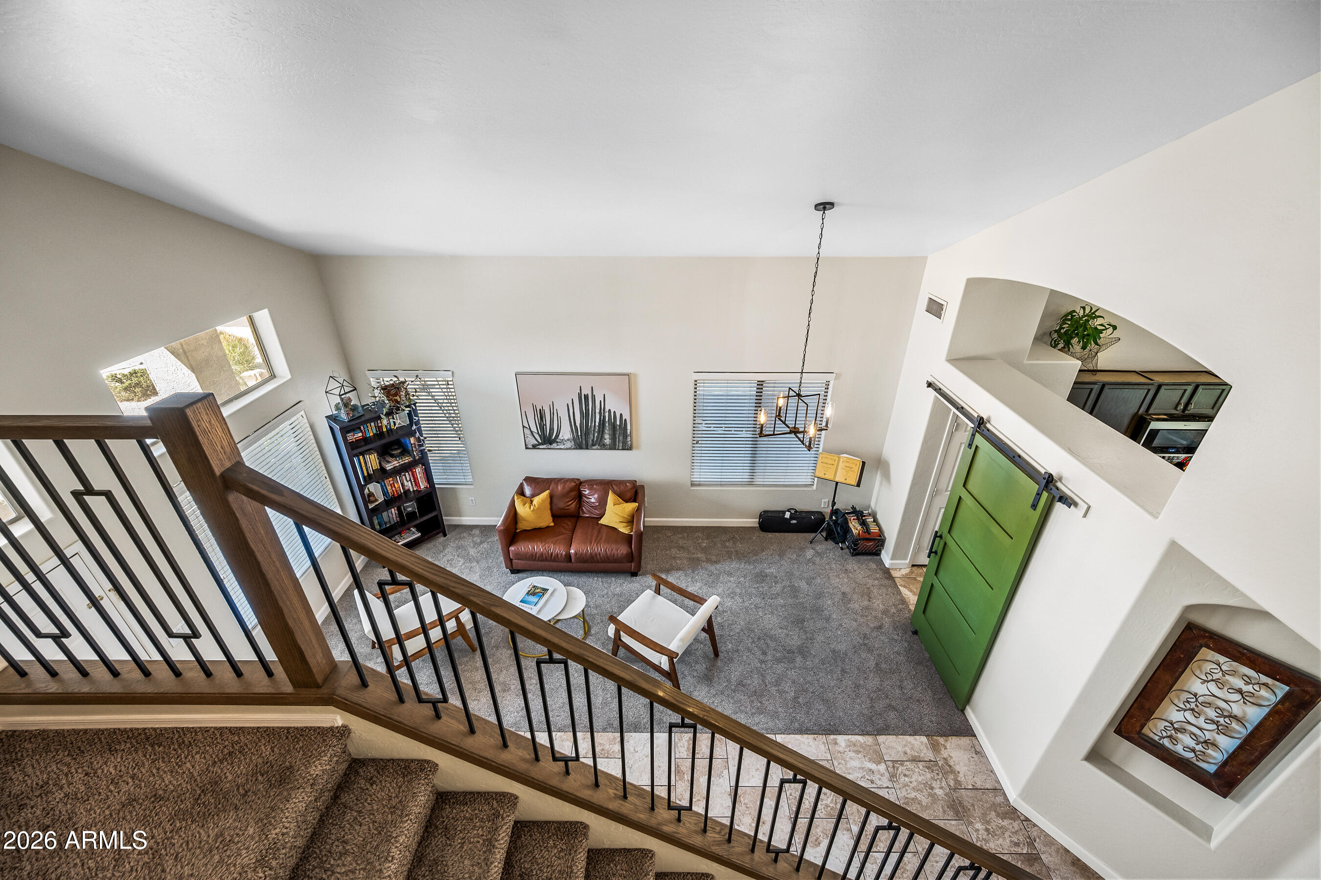 12734 West Cheery Lynn Road Avondale, AZ 85392 - Photo 36 of 54 a living room with furniture and a flat screen tv