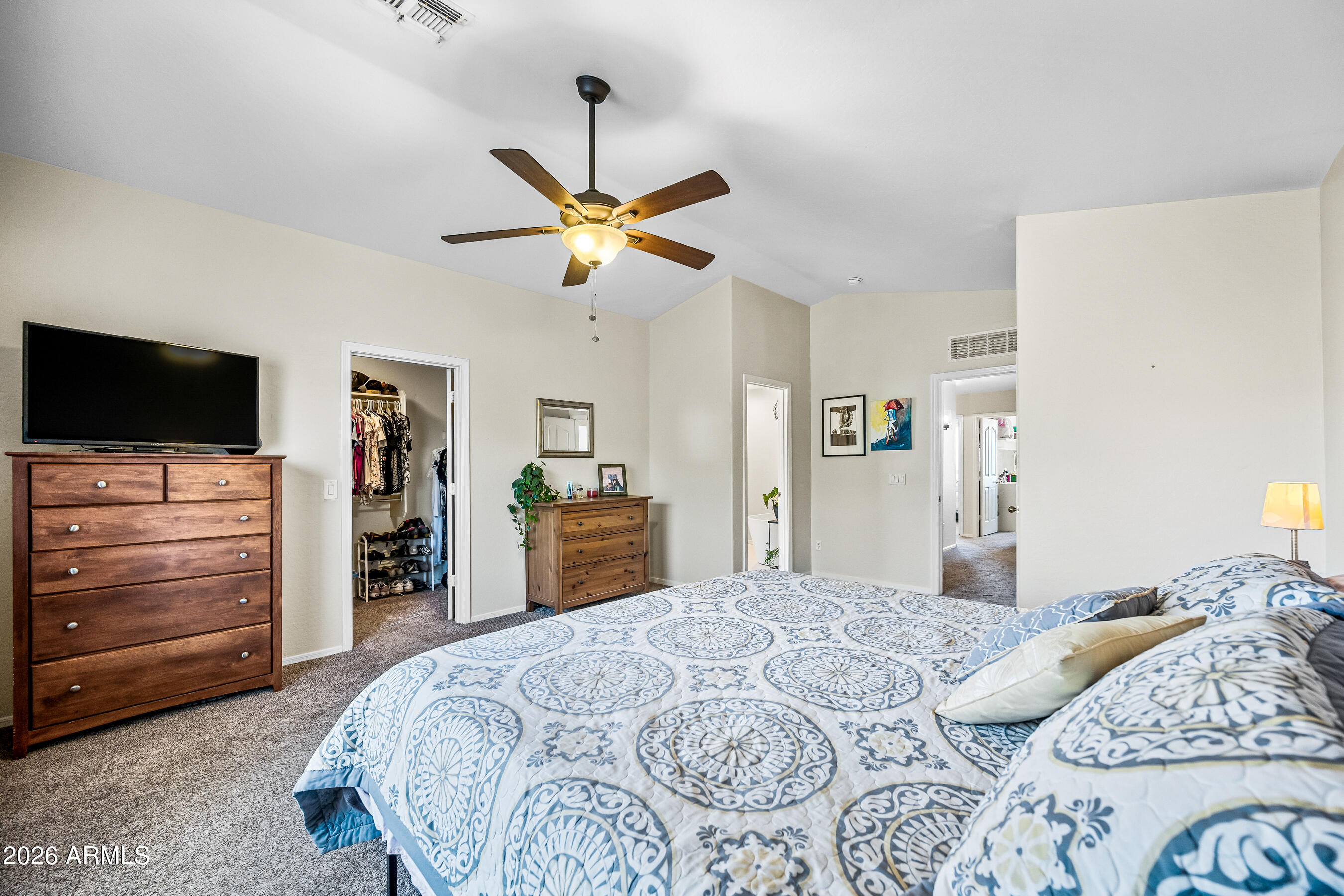 12734 West Cheery Lynn Road Avondale, AZ 85392 - Photo 41 of 54 a bedroom with a bed and a flat screen tv