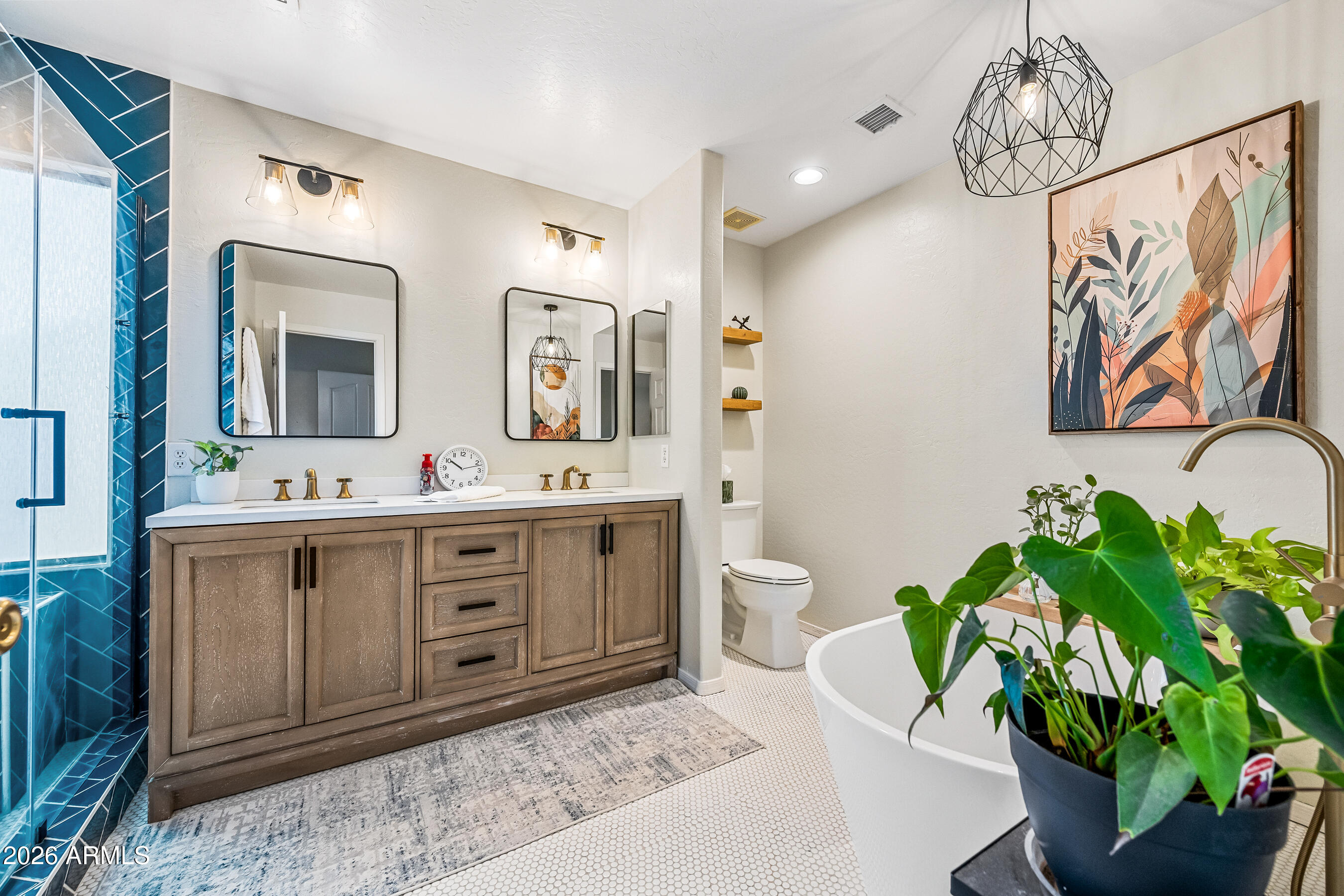 12734 West Cheery Lynn Road Avondale, AZ 85392 - Photo 42 of 54 a spacious bathroom with a granite countertop sink and a mirror