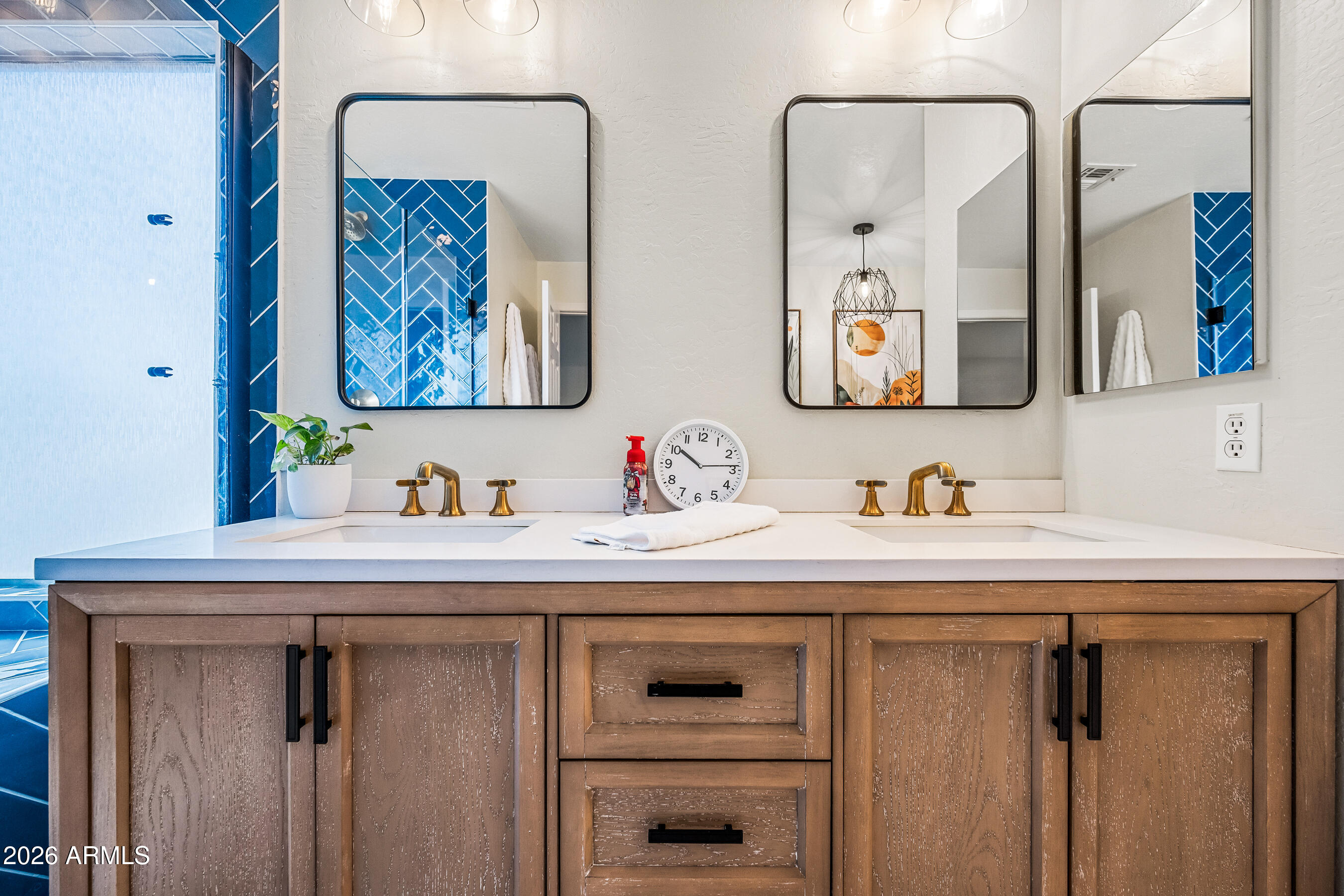 12734 West Cheery Lynn Road Avondale, AZ 85392 - Photo 45 of 54 a bathroom with a sink and a mirror