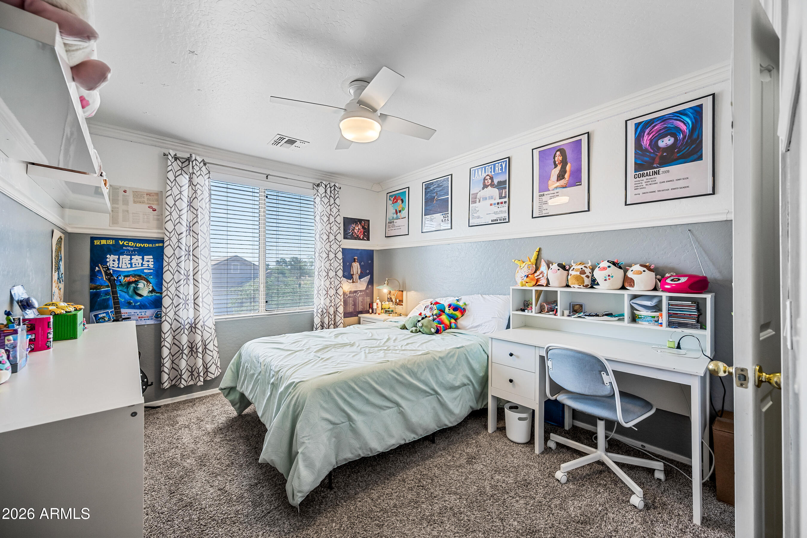 12734 West Cheery Lynn Road Avondale, AZ 85392 - Photo 48 of 54 a bedroom with a bed and a desk