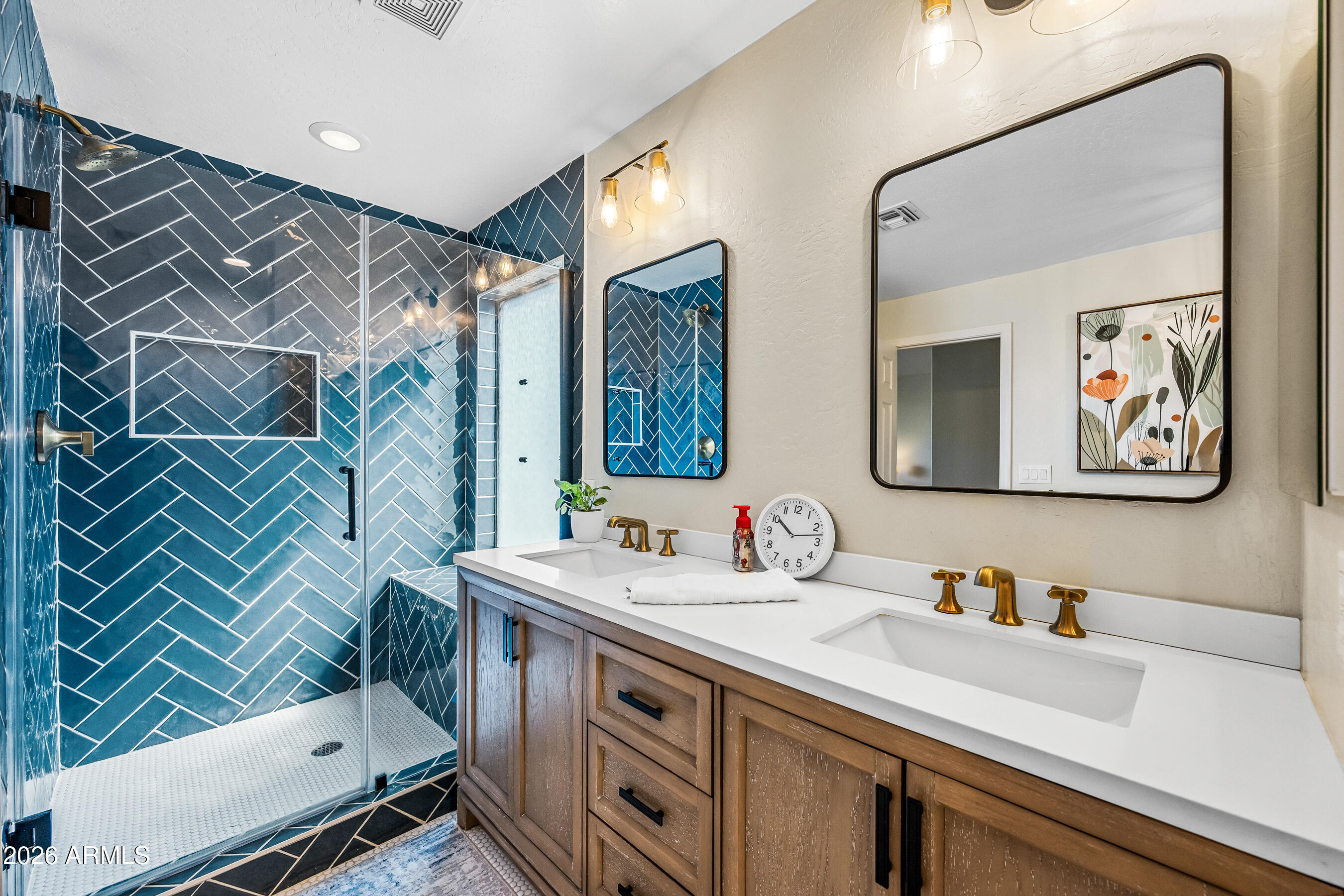 12734 West Cheery Lynn Road Avondale, AZ 85392 - Photo 7 of 54 a bathroom with a sink and a mirror