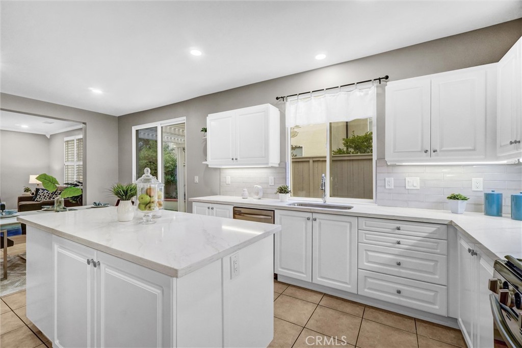 45 Avondale Irvine, CA 92602 - Photo 12 of 28 a kitchen with cabinets appliances and a window