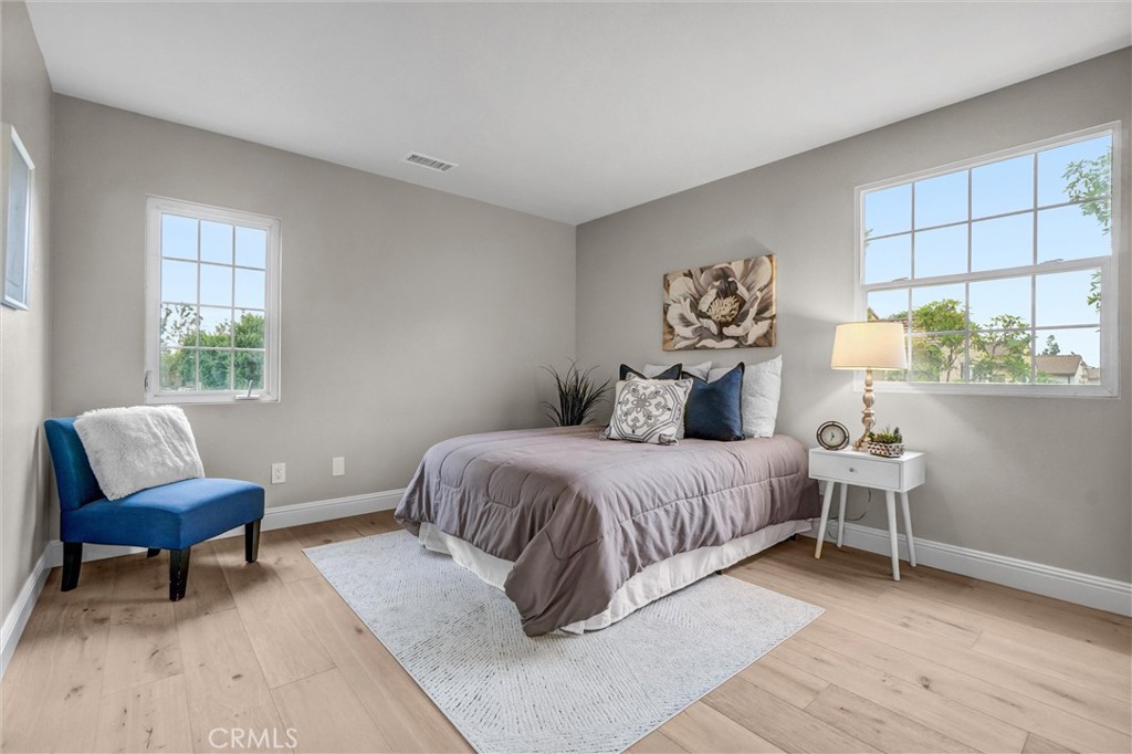 45 Avondale Irvine, CA 92602 - Photo 18 of 28 a bedroom with a bed and a chair