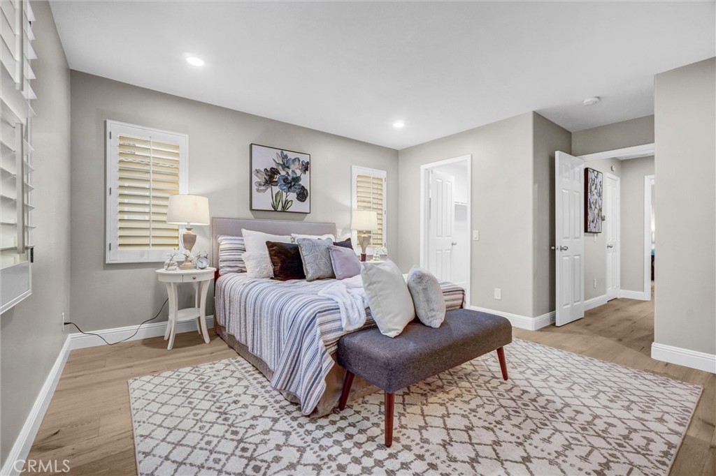 45 Avondale Irvine, CA 92602 - Photo 20 of 28 a bedroom with a bed and wooden floor