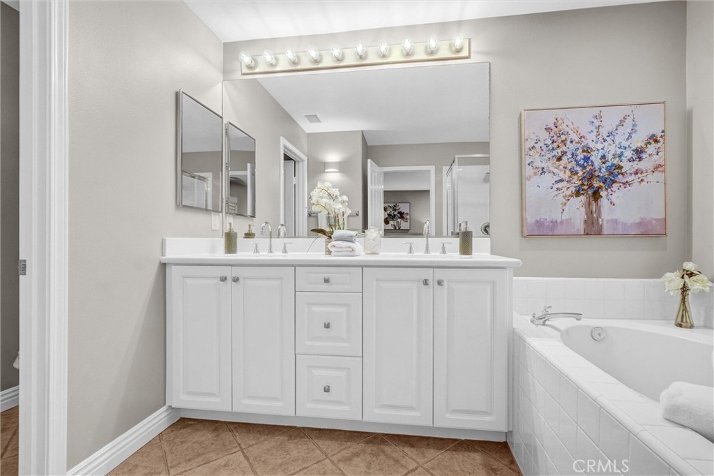 45 Avondale Irvine, CA 92602 - Photo 21 of 28 a bathroom with a sink a mirror and a bathtub