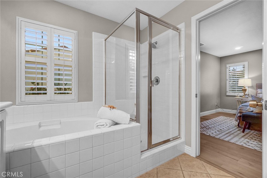 45 Avondale Irvine, CA 92602 - Photo 22 of 28 a bathroom with a bathtub and a shower