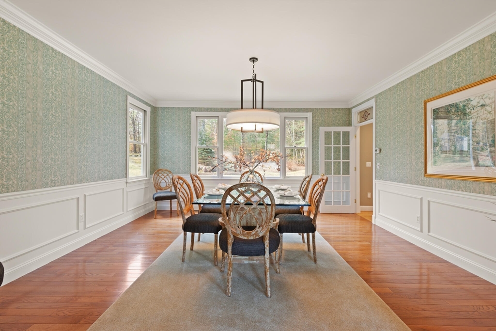 33 Bulkley Road Sudbury, MA 01776 - Photo 15 of 42 a view of a dining room with furniture window and wooden floor