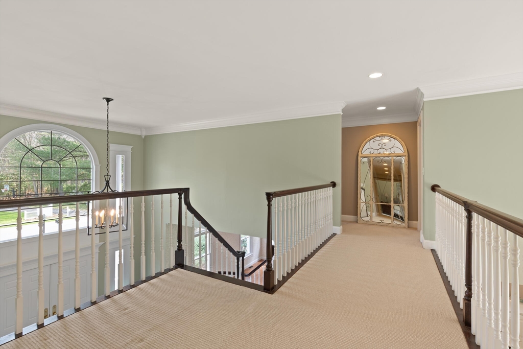 33 Bulkley Road Sudbury, MA 01776 - Photo 21 of 42 a view of a hallway with windows