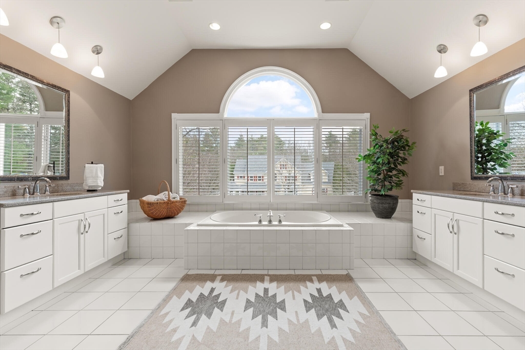 33 Bulkley Road Sudbury, MA 01776 - Photo 24 of 42 a spacious bathroom with a tub sink and mirror