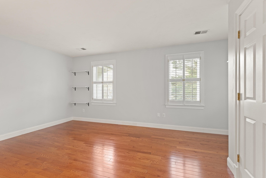 33 Bulkley Road Sudbury, MA 01776 - Photo 29 of 42 an empty room with wooden floor and windows
