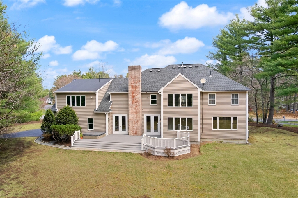 33 Bulkley Road Sudbury, MA 01776 - Photo 3 of 42 a front view of a house with a yard