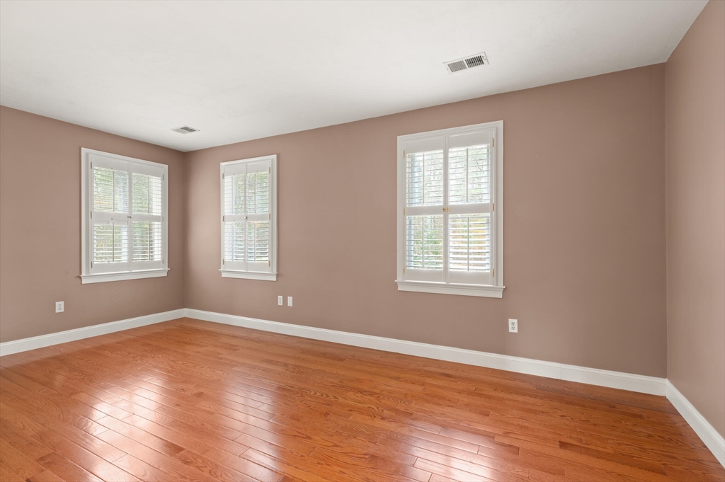 33 Bulkley Road Sudbury, MA 01776 - Photo 31 of 42 a view of empty room with wooden floor and fan