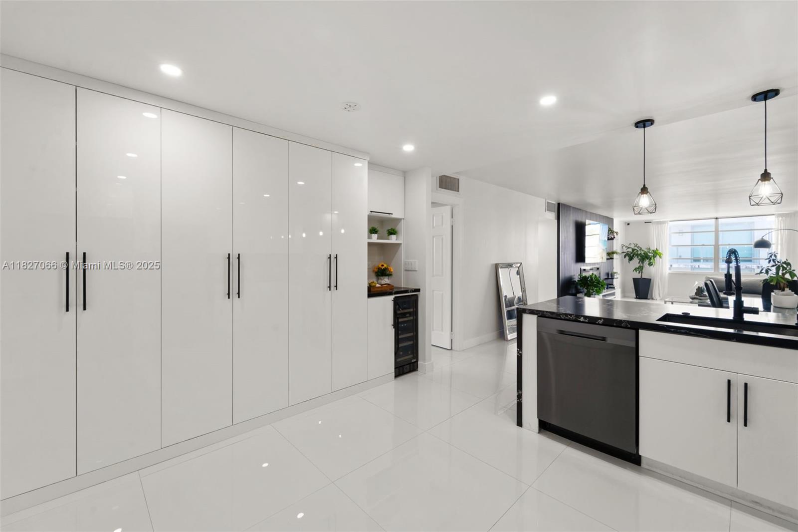1050 93rd Street, Unit 7H Bay Harbor Islands, FL 33154 - Photo 4 of 18 a kitchen with stainless steel appliances granite countertop refrigerator sink and cabinets