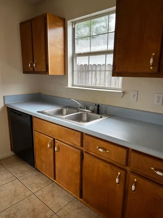 a kitchen with stainless steel appliances granite countertop a sink and a cabinets