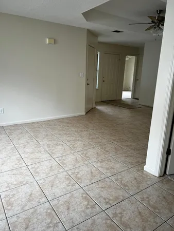 a view of an empty room and stairs