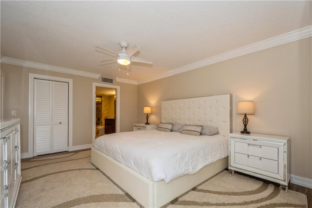 6000 Northwest 2nd Avenue, Unit 437 Boca Raton, FL 33487 - Photo 14 of 22 a large white bed in a white room