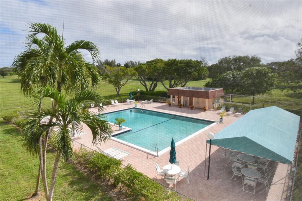 6000 Northwest 2nd Avenue, Unit 437 Boca Raton, FL 33487 - Photo 22 of 22 a view of a swimming pool with a yard