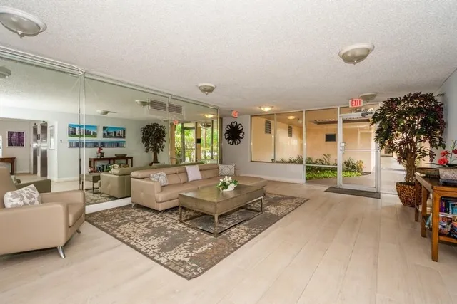 a living room with furniture and a table