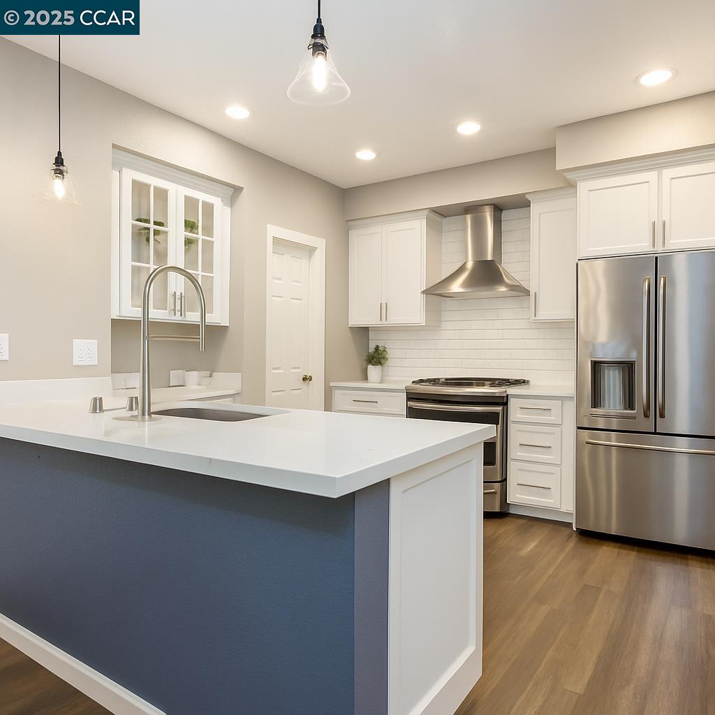 57 Karkin Place Clayton, CA 94517 - Photo 2 of 2 a kitchen with stainless steel appliances a sink stove and refrigerator