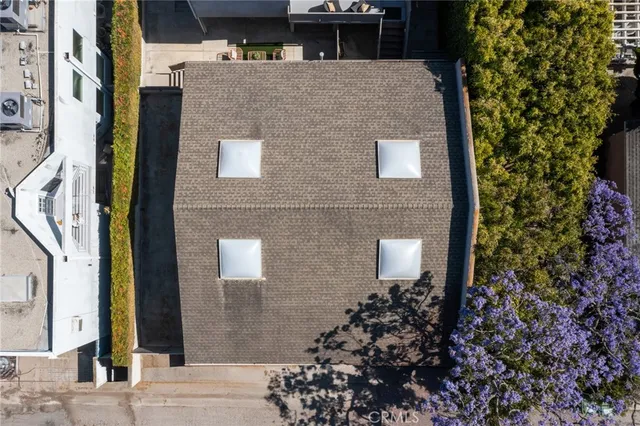 a kitchen with a sink and stove top oven