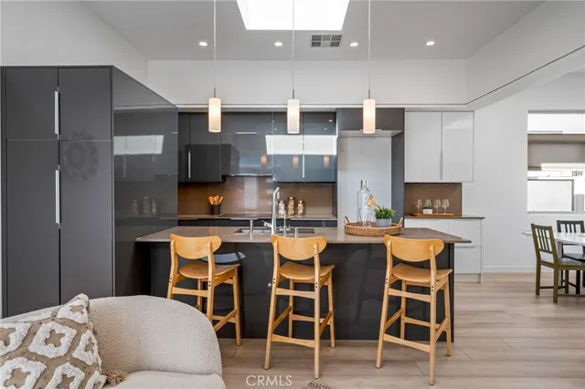 a view of a hallway with wooden cabinets