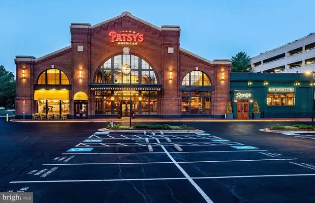 a city street filled with lots of traffic and tall building
