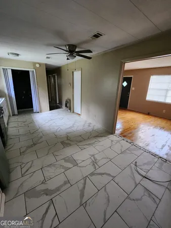 a bedroom with a bed and a mirror