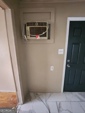 a view of an empty room and a window