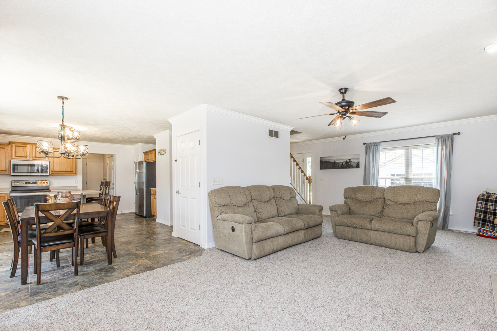 3230 Turquois Way Normal, IL 61761 - Photo 6 of 28 a living room with furniture and a chandelier